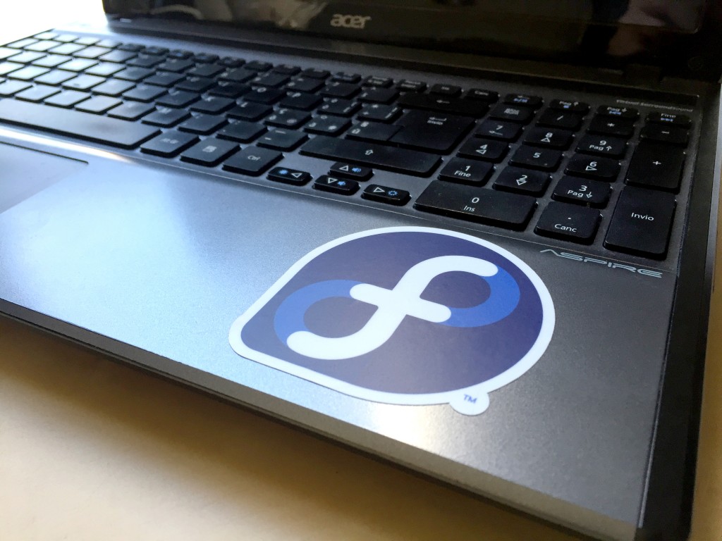 Fedora stickers on laptop