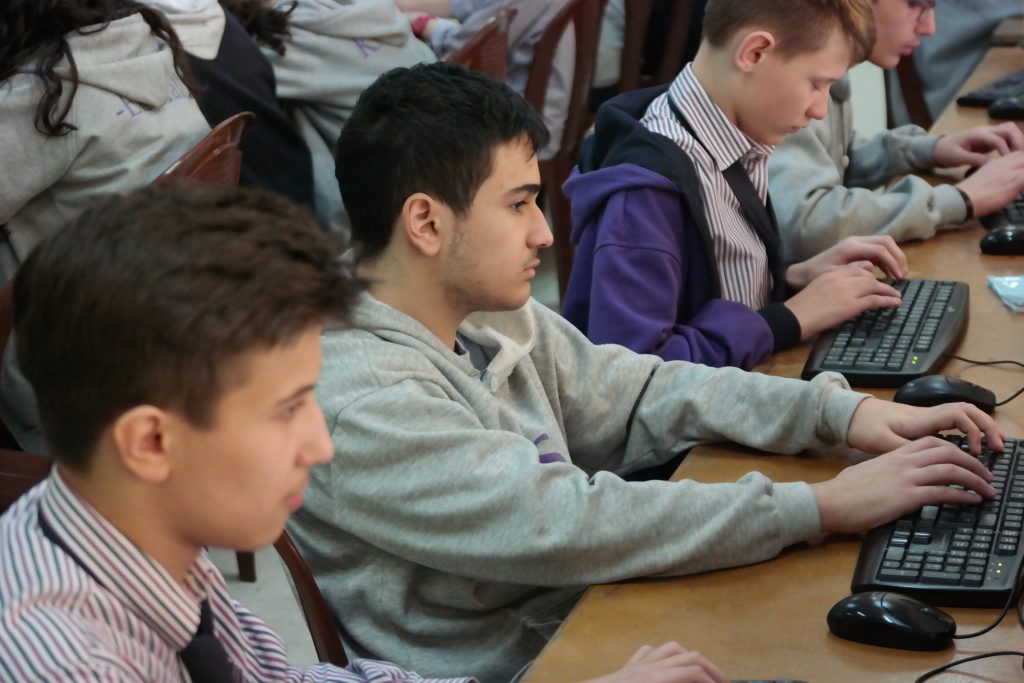 Students in Lebanon Evangelical School working on lab assignment with Fedora Workstation