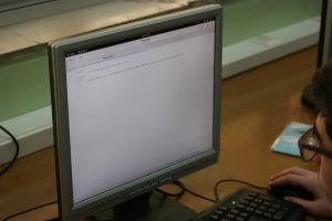 Student in Lebanon Evangelical School works on HTML project with Fedora