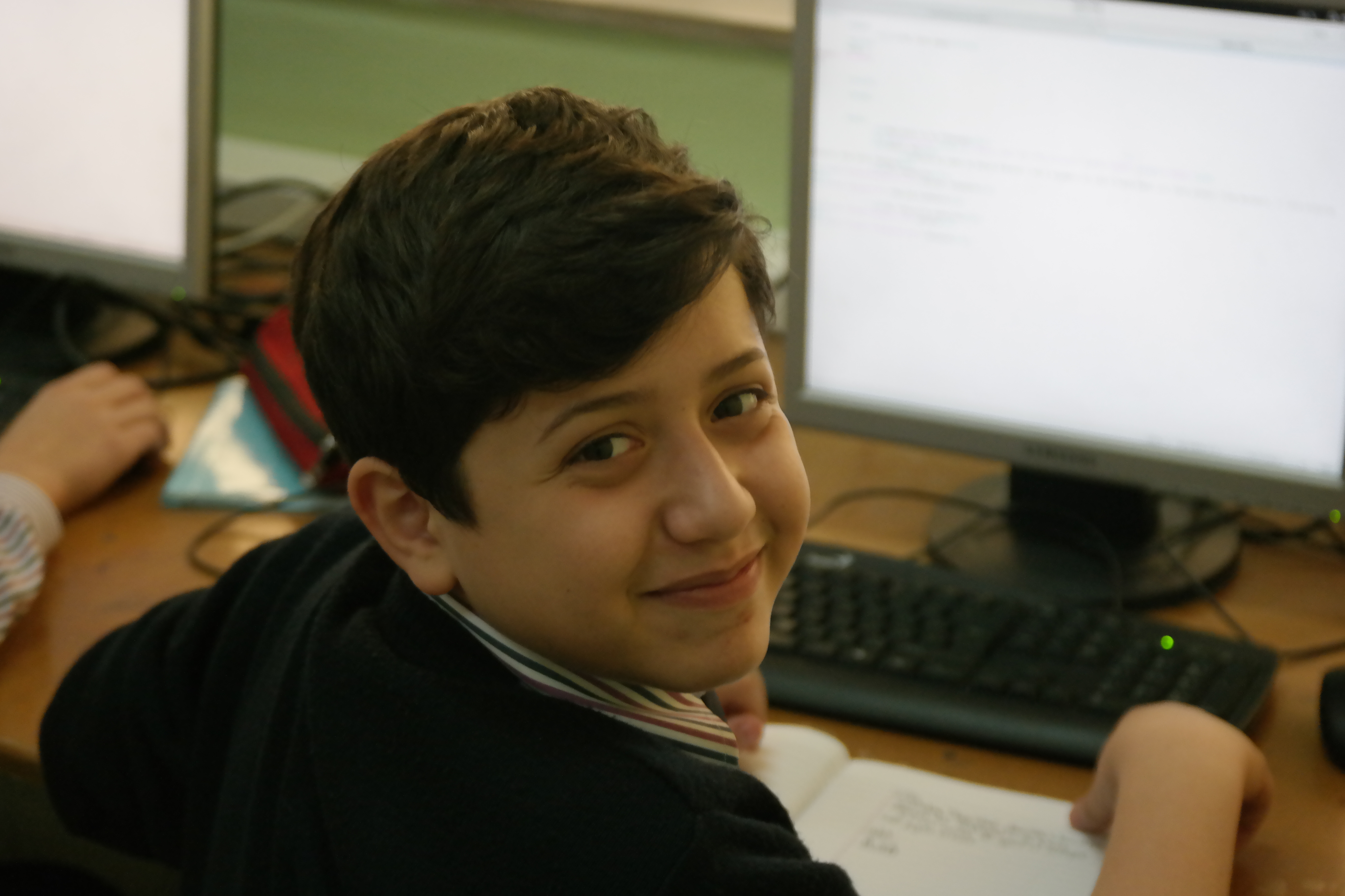 Student from Lebanon Evangelical School works on lab assignment with Fedora Workstation