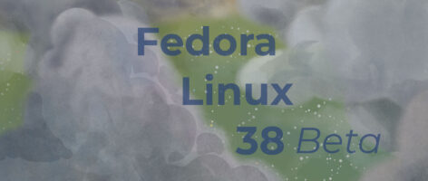 The text "Fedora Linux 38 Beta" on the default Fedora Linux 38 background image: cumuloform clouds with a green field in the background