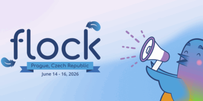 Banner image for the Flock to Fedora 2026 conference. The image shows Colúr, the animated mascot of Flock, holding a megaphone. The "Flock" logo appears with "Prague, Czech Republic" and "June 14 - 16, 2026" written below the Flock logo.