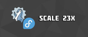 A graphic featuring a Linux penguin in front of a gear, a blue Fedora logo, and the text "SCaLE 23X" against a dark gray background.